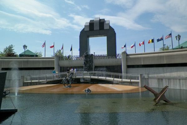 Bedford, VA Insurance Agency, nearby National D Day Memorial bronze statues of soldiers emerging from water memorializing D-Day invasion.