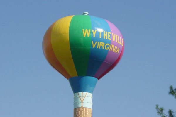 Wytheville, VA water tower painted in colorful stripes, the final product resembling a hot air balloon.
