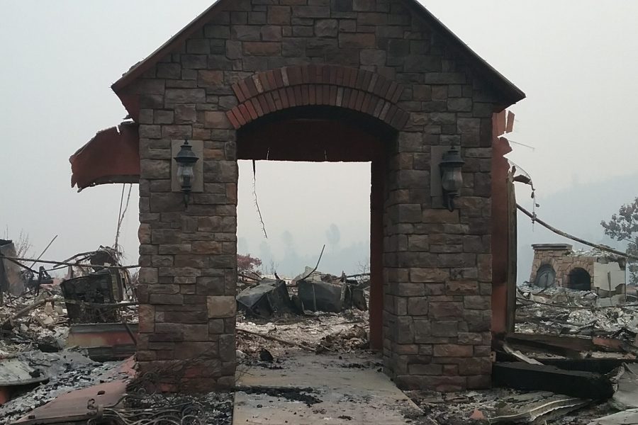 Burned stone entryway without home at Kincade fire location.