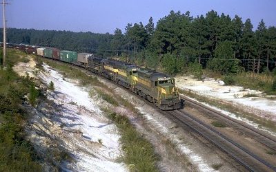 Cargo train on snowy tracks.