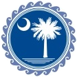 Round blue seal with palmetto tree and moon.