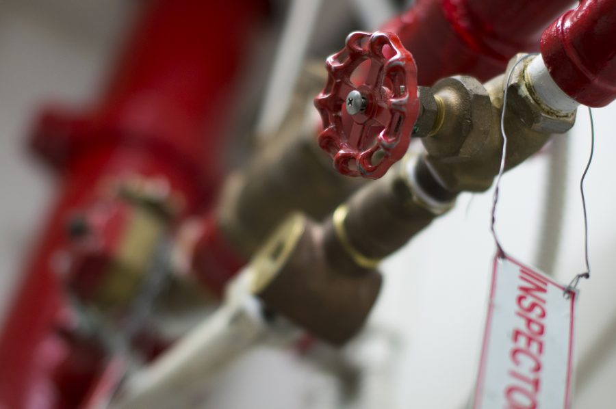 Red fire sprinkler system inspection valve.
