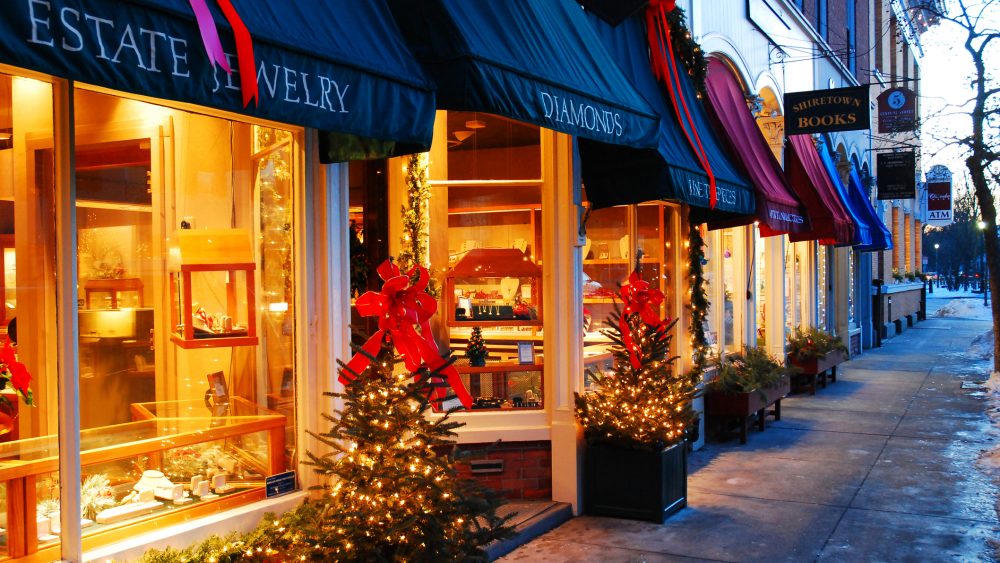 Downtown business storefronts decorated for Christmas.